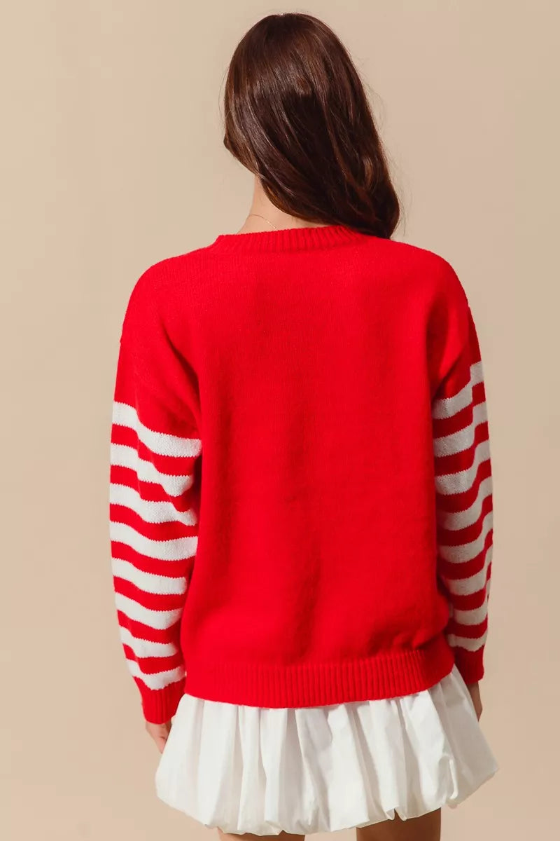 Red Christmas snowflake crochet sweater with ivory striped sleeves and ribbed hem