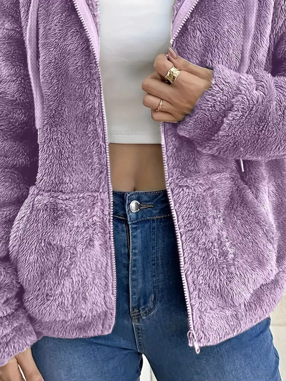Lavender purple fleece zip-up jacket close-up with silver zipper and pockets