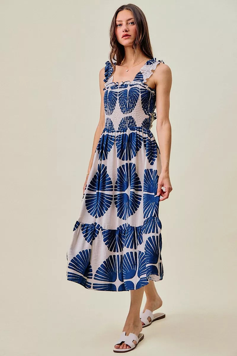 Navy and white abstract print sleeveless midi dress with smocked bodice and tiered skirt