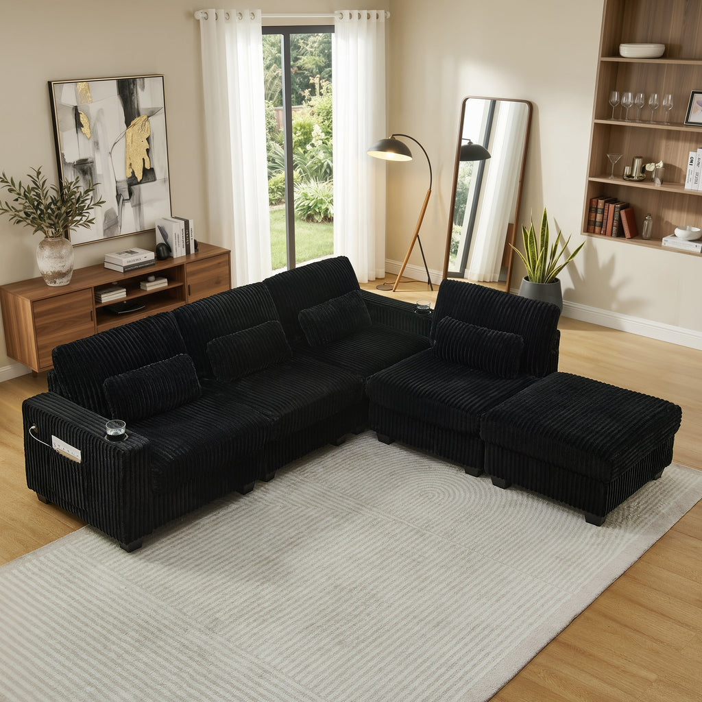 Black corduroy L-shaped sectional sofa with extended chaise and padded armrests