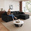 Black corduroy sectional sofa with chaise, wide armrests and square back cushions