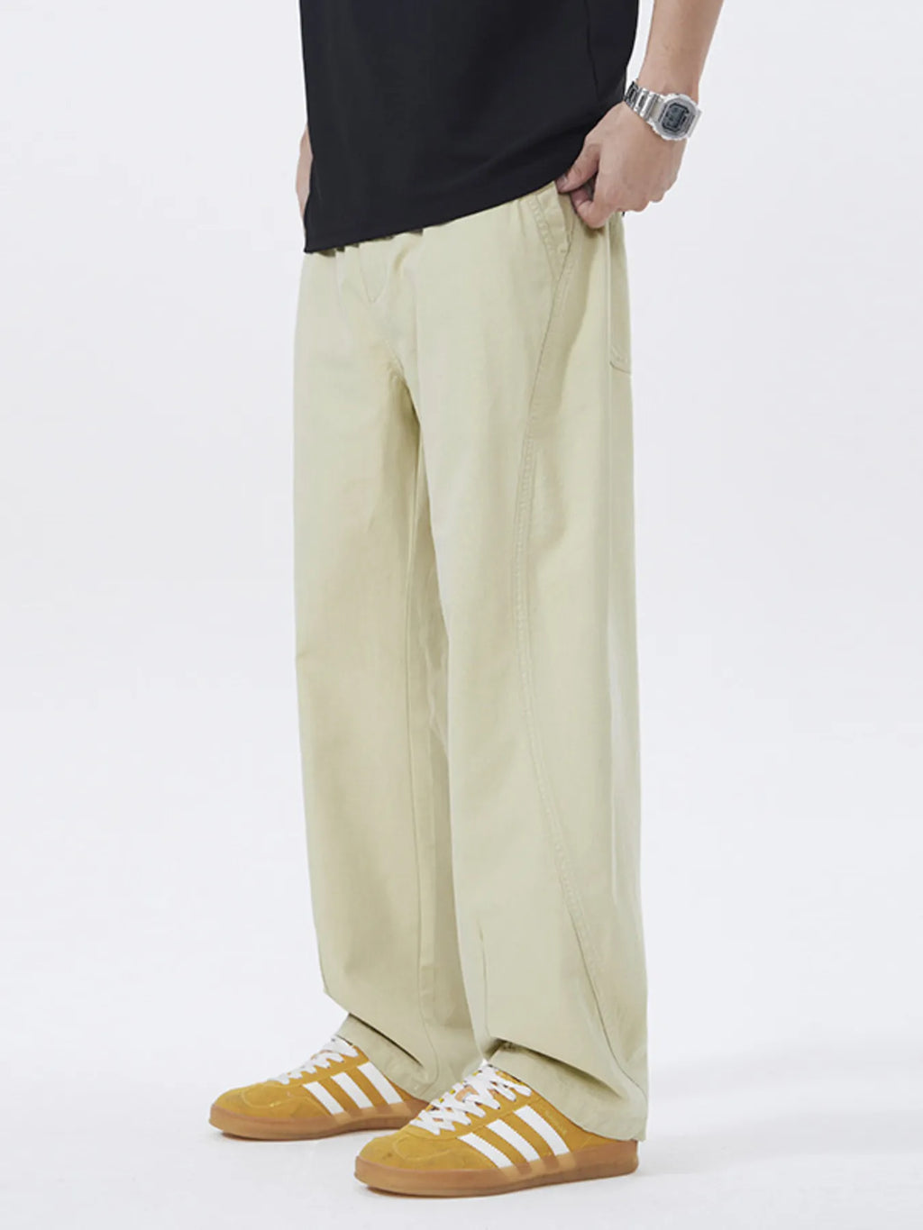 Khaki loose-fit casual pants with side pockets and relaxed straight legs