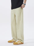 Khaki loose-fit casual pants with side pockets and relaxed straight legs