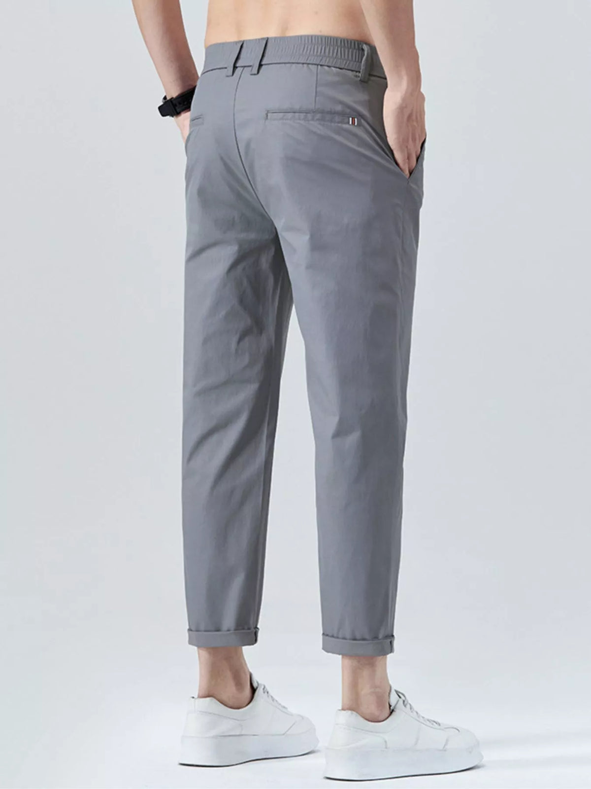 Men's straight-leg cropped pants in gray with belt loops and front button closure