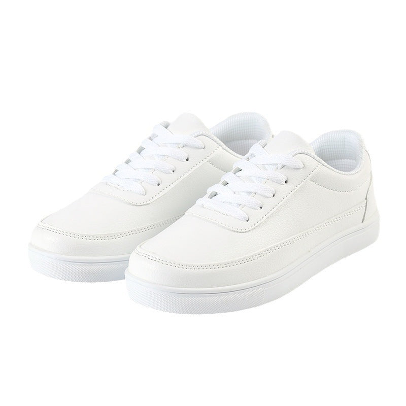 Pair of white lace-up casual sneakers with padded tongue and clean toe