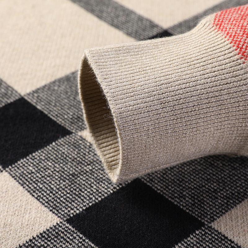 Men's sweater sleeve cuff in beige knit over black and gray plaid print