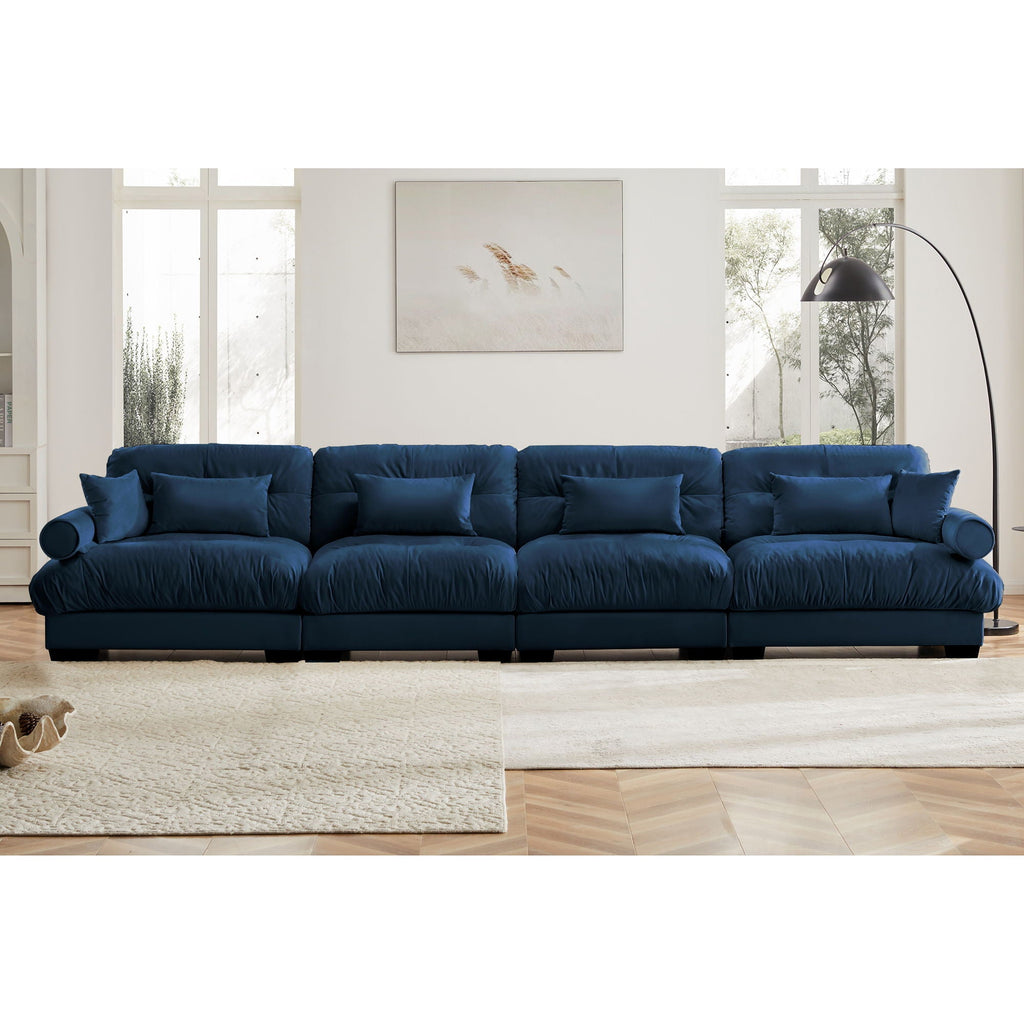 Dark blue modular sectional sofa with deep seat, rolled arms, and tufted cushion look