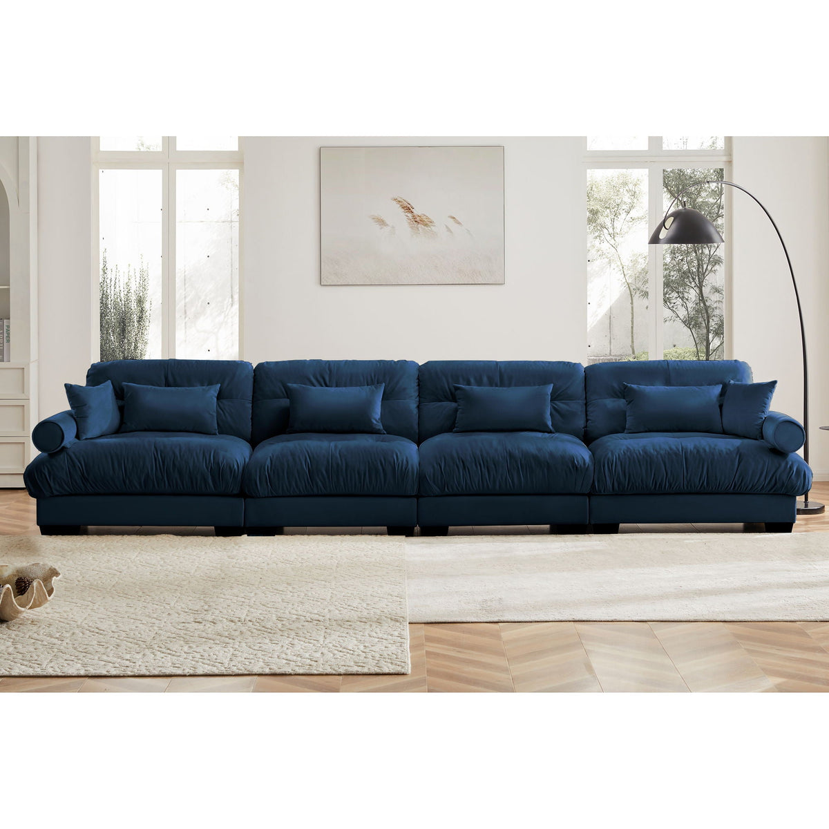 Dark blue modular sectional sofa with deep seat, rolled arms, and tufted cushion look