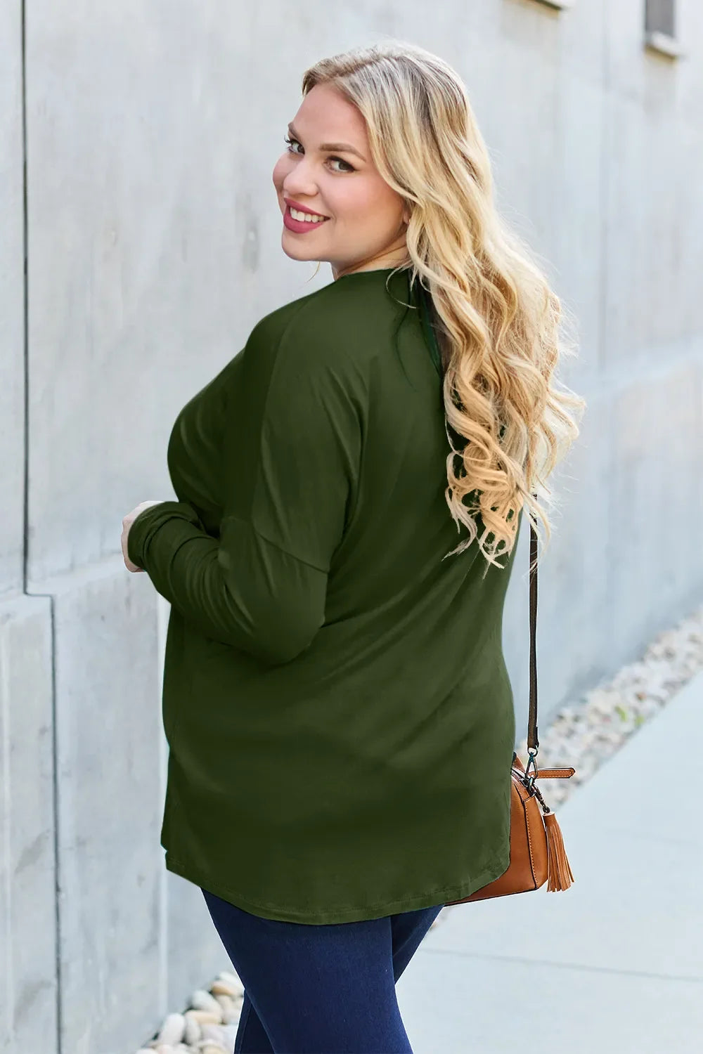 Army green relaxed long-sleeve tee, side view with crew neck and rounded hem