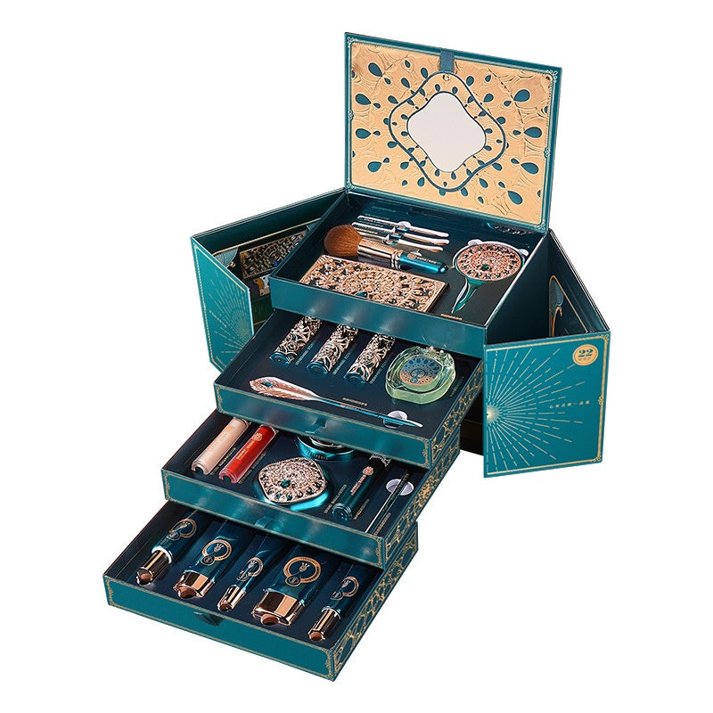 Open blue and gold makeup set case with divided compartments and brushes