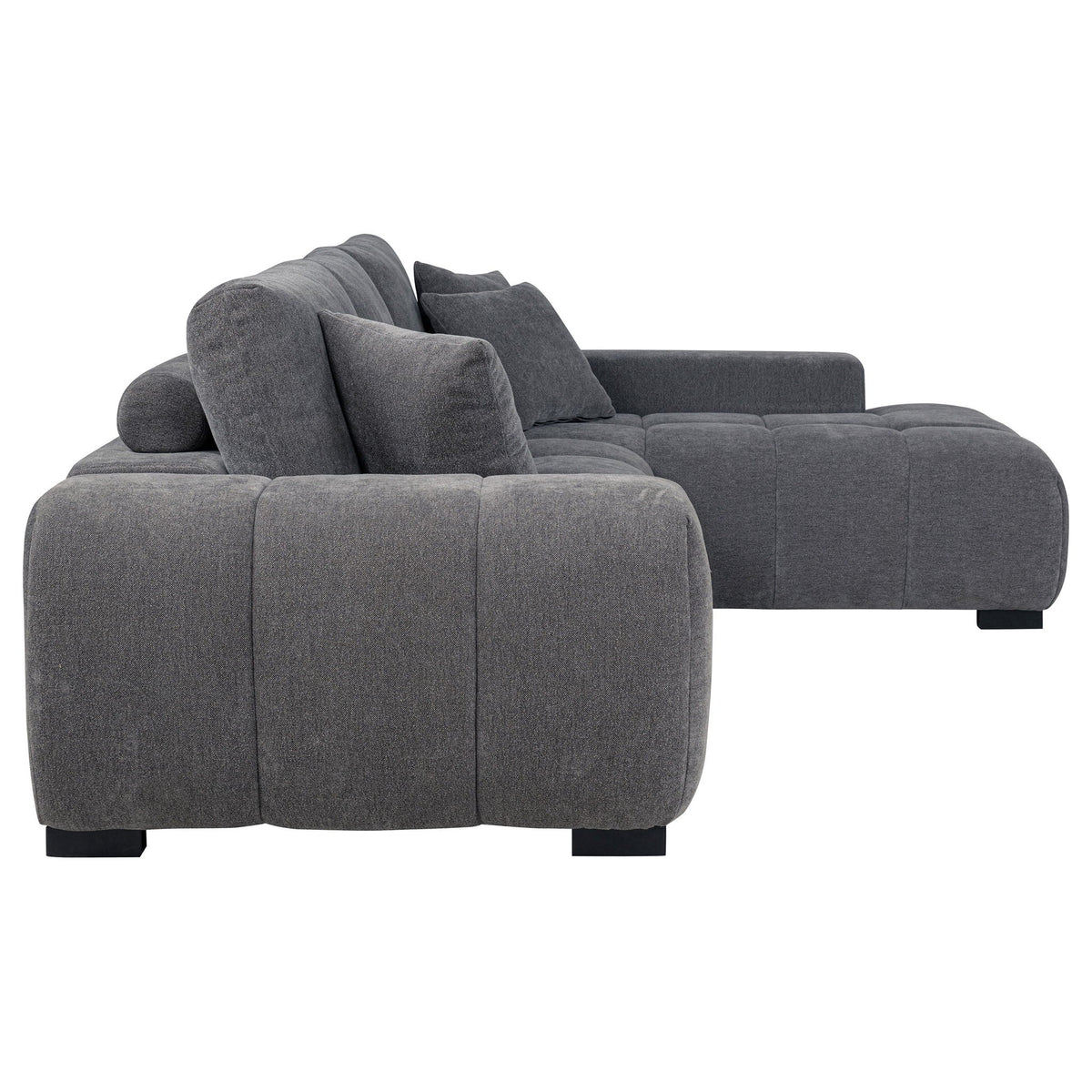 Charcoal gray chaise sectional sofa with wide arm, deep seat cushions, and stacked back cushions
