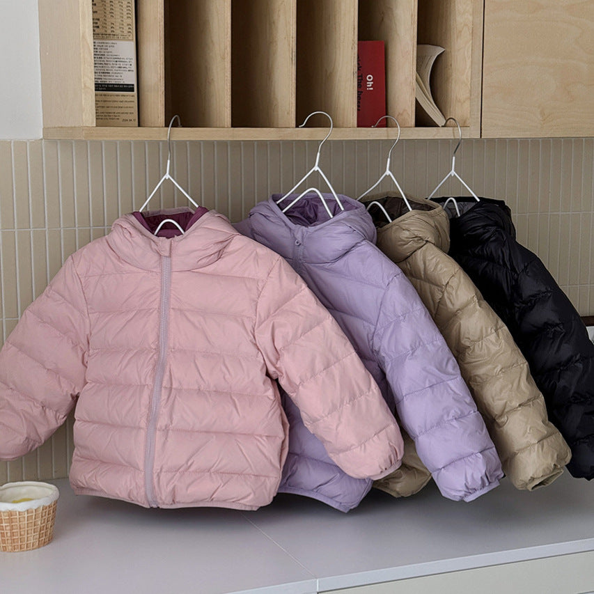 Kids' hooded puffer jackets on hangers in pink, lavender, beige, and black