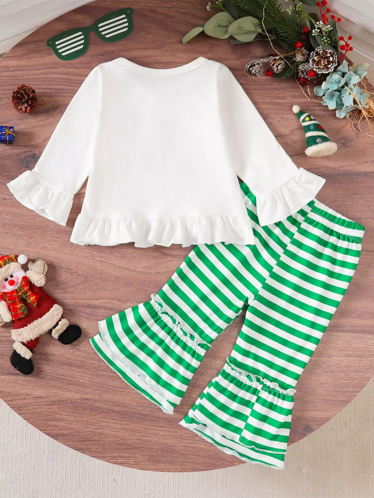 Children's Christmas set: white ruffle top with flared sleeves and green striped pants