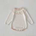 Off-white knitted baby romper with lace collar and long sleeves; ribbed hem edge