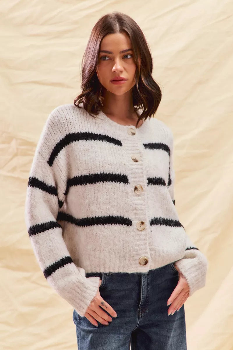 Striped button-front knit cardigan with long sleeves, cream with black horizontal stripes