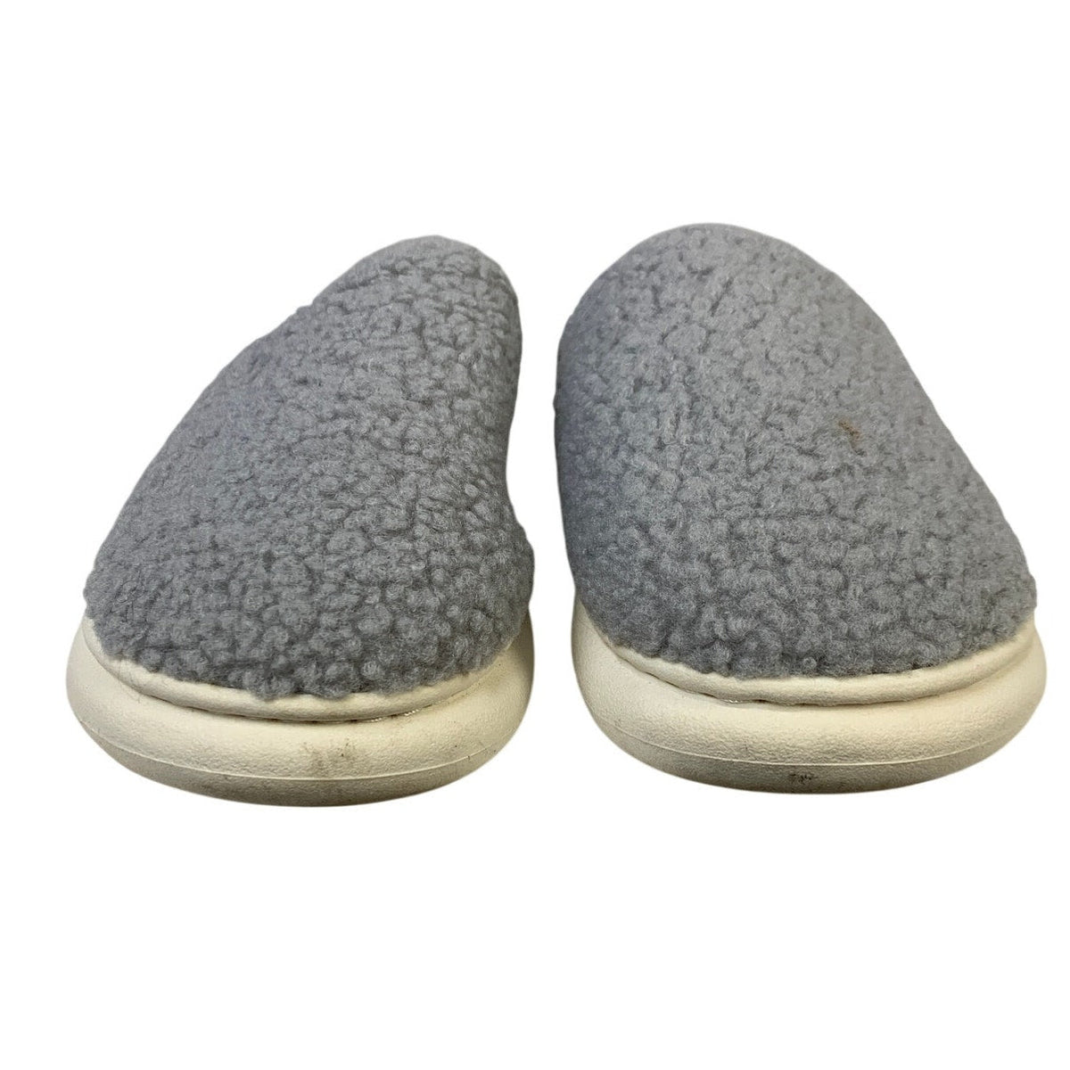 Gray fuzzy closed-toe slip-on slippers with cream sole edge