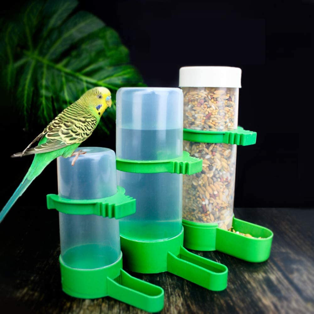 Three clear bird feeders with green bases and troughs, including seed and water dispensers