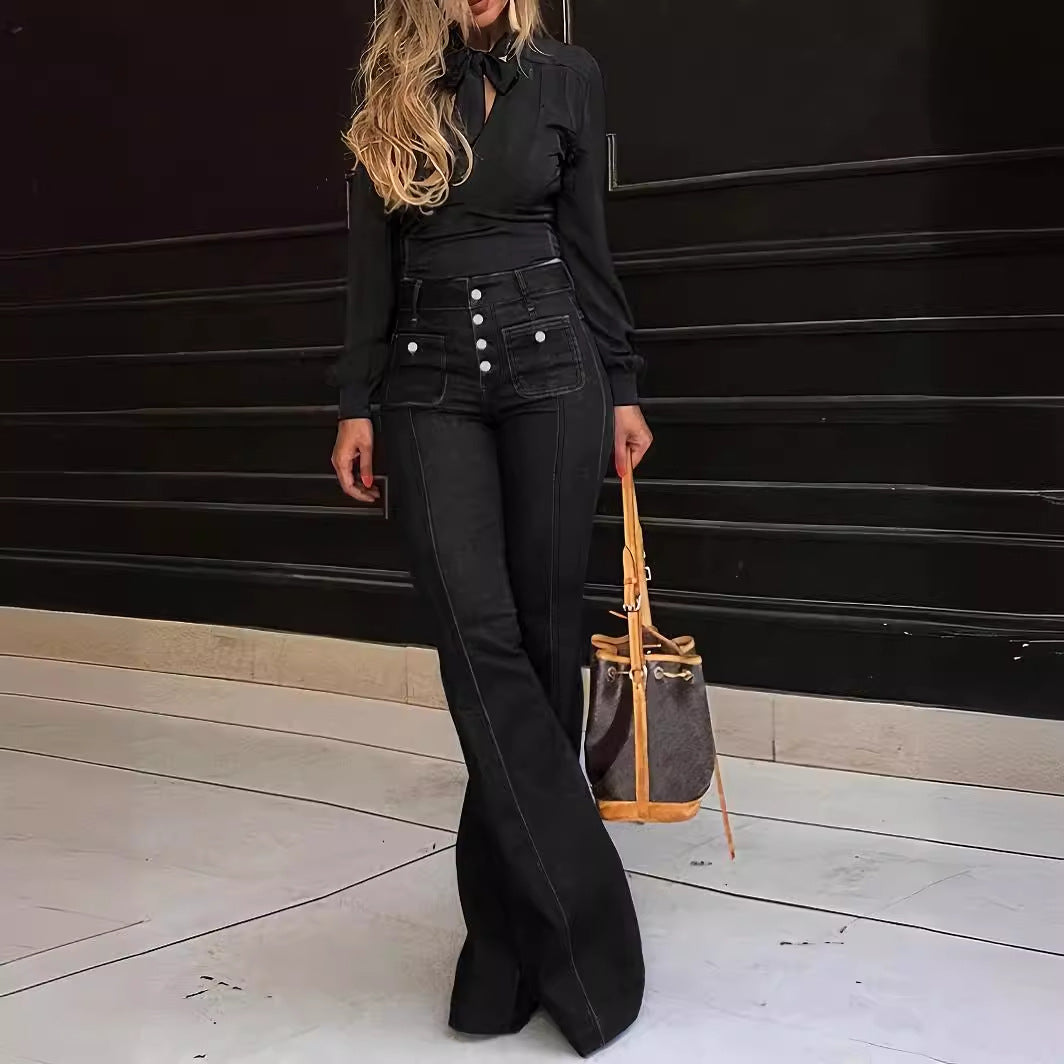 Black flared jeans with silver button front and five-pocket styling