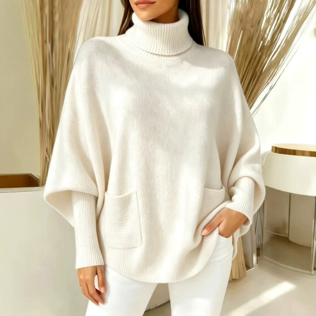 White women’s turtleneck sweater with long sleeves and front patch pocket