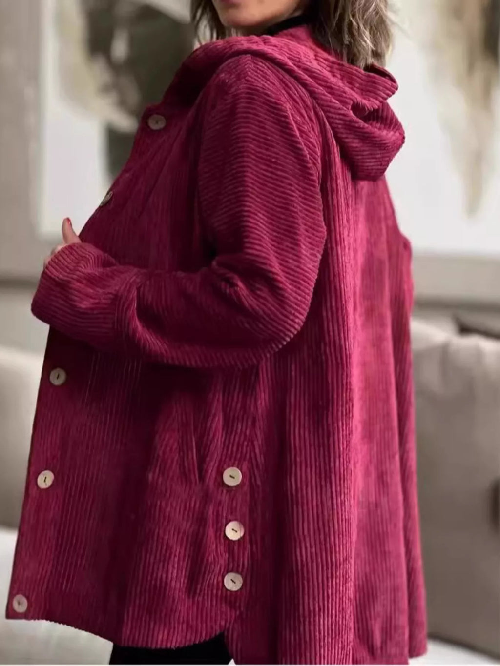 Burgundy corduroy hooded jacket, side view, with button front and long sleeves