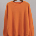 Orange knitted crew-neck loose sweater with ribbed collar and hem, long sleeves