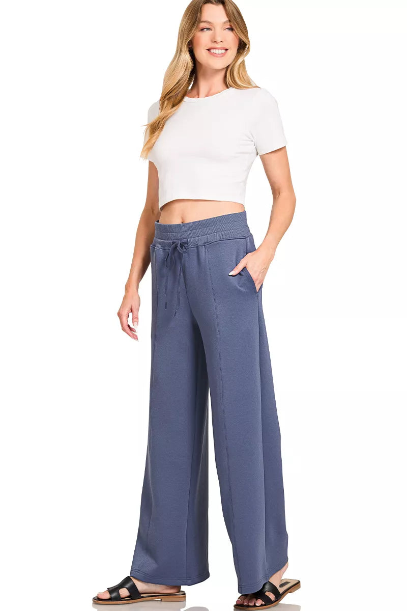 Blue indigo wide-leg pants with elastic waist and side drawstring ties