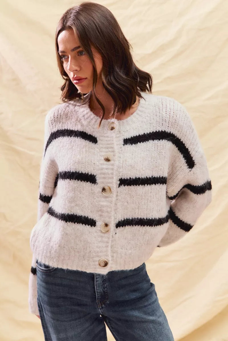 Relaxed-fit cardigan sweater in cream with black striped bands and button front