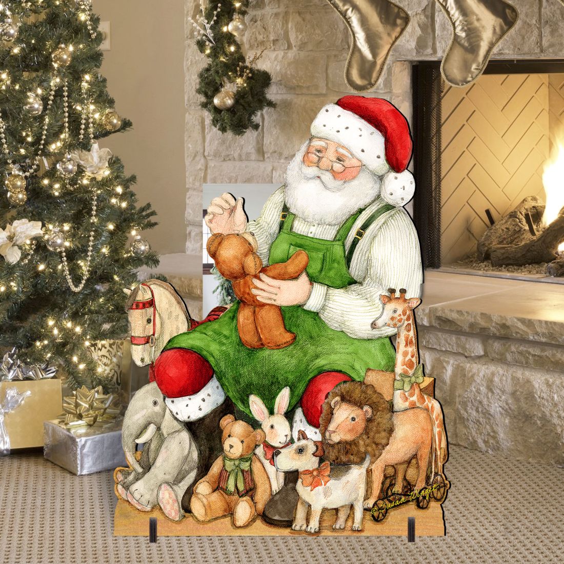 Santa outdoor decor with green coat and animal figures on a wooden base beside a fireplace