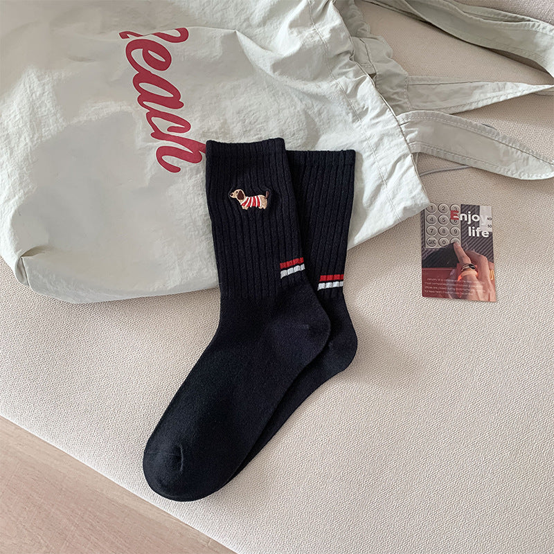 Children's black ribbed socks with dog embroidery and red/blue stripe on cuff