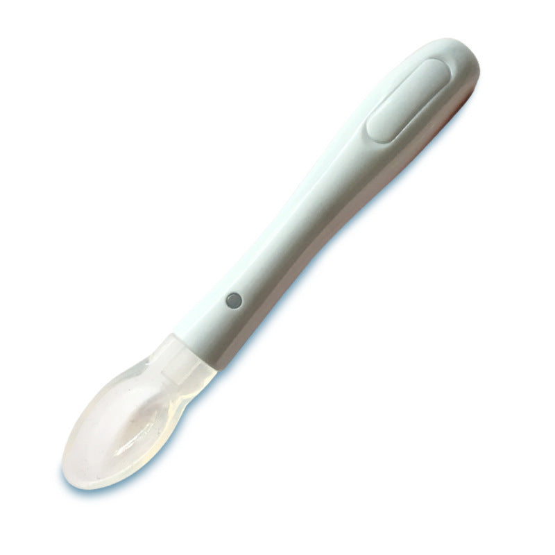 Infant silicone soft-tip spoon with soft transparent tip, light blue handle