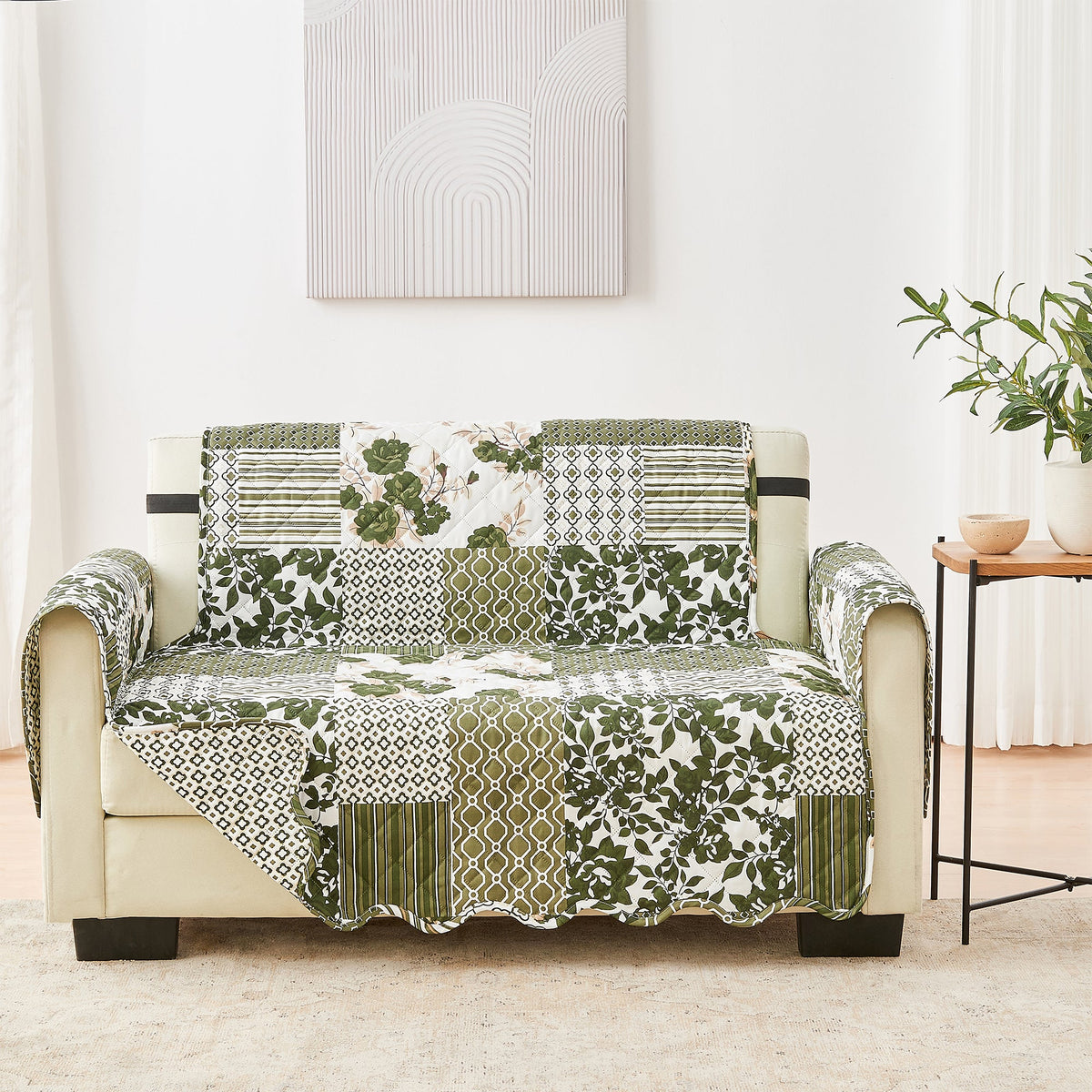 Reversible loveseat furniture protector, green patchwork floral and geometric patterns