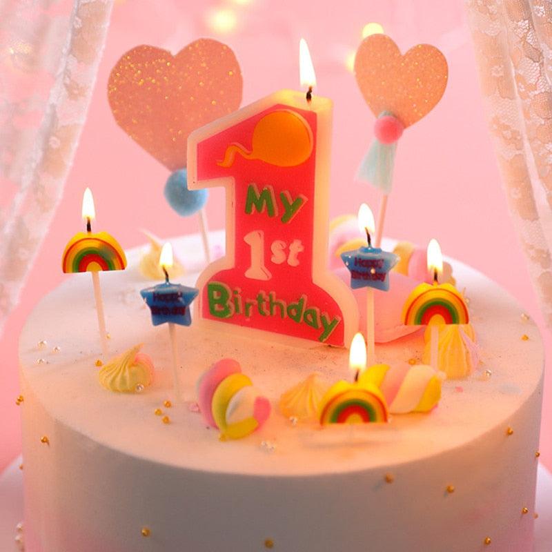 Colorful "My 1st Birthday" number 1 candle topper with flames and whipped-style decor