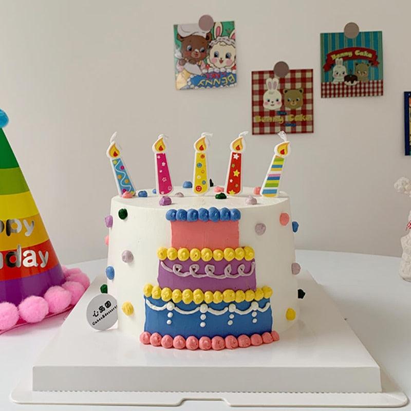 Birthday cake with colorful number candles on top