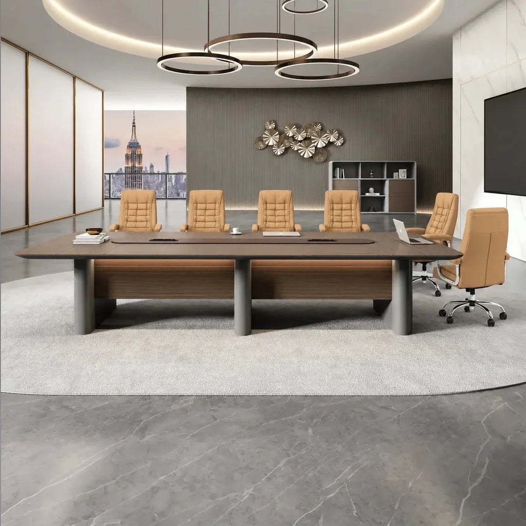 Conference room meeting table with dark surface and gray legs, used with tan swivel chairs