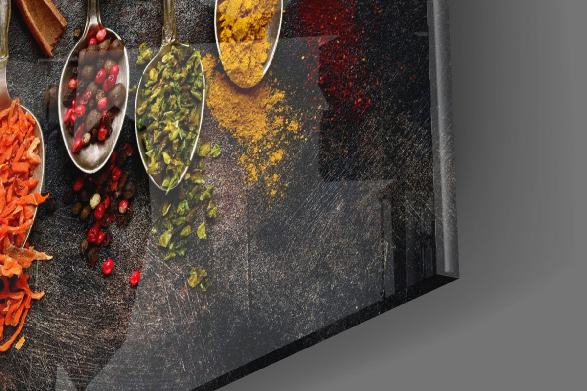 Close-up glass wall art of colorful spice spoons with herbs, powders, and speckles