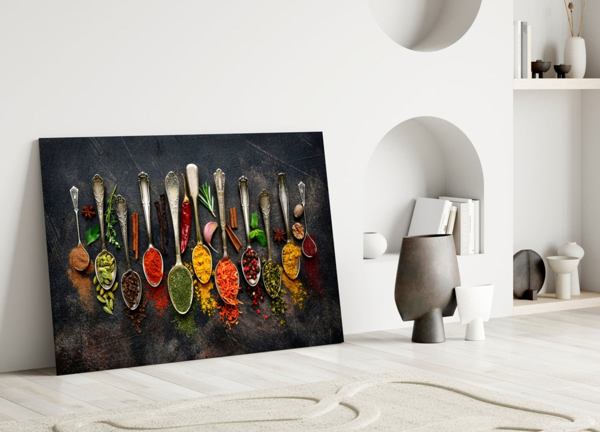 Glass wall art with a row of colorful spice spoons, oval and spoon-shaped accents
