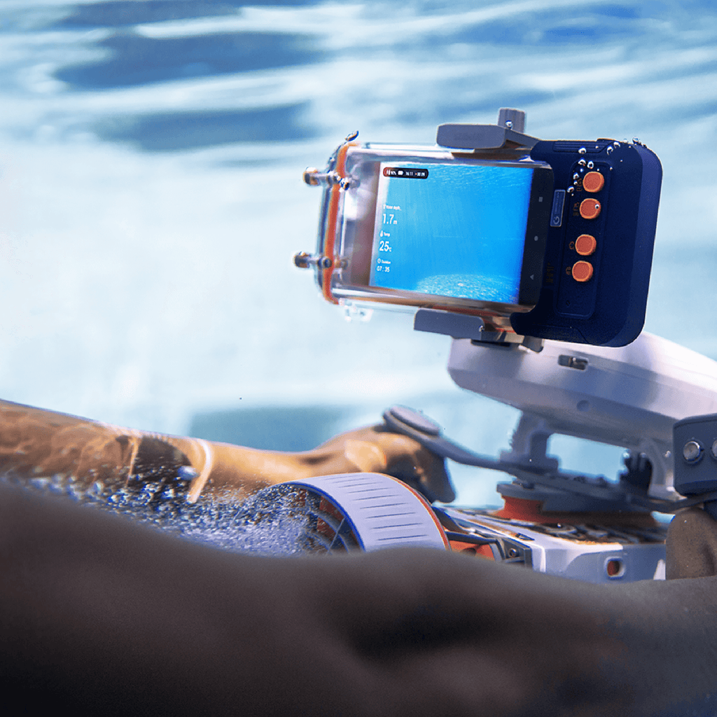 Waterproof phone case with dark blue back and clear screen window, held in water.