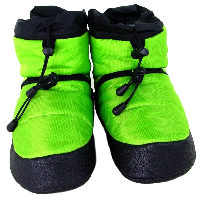 Pair of lime green camp booties with black laces and padded navy soles