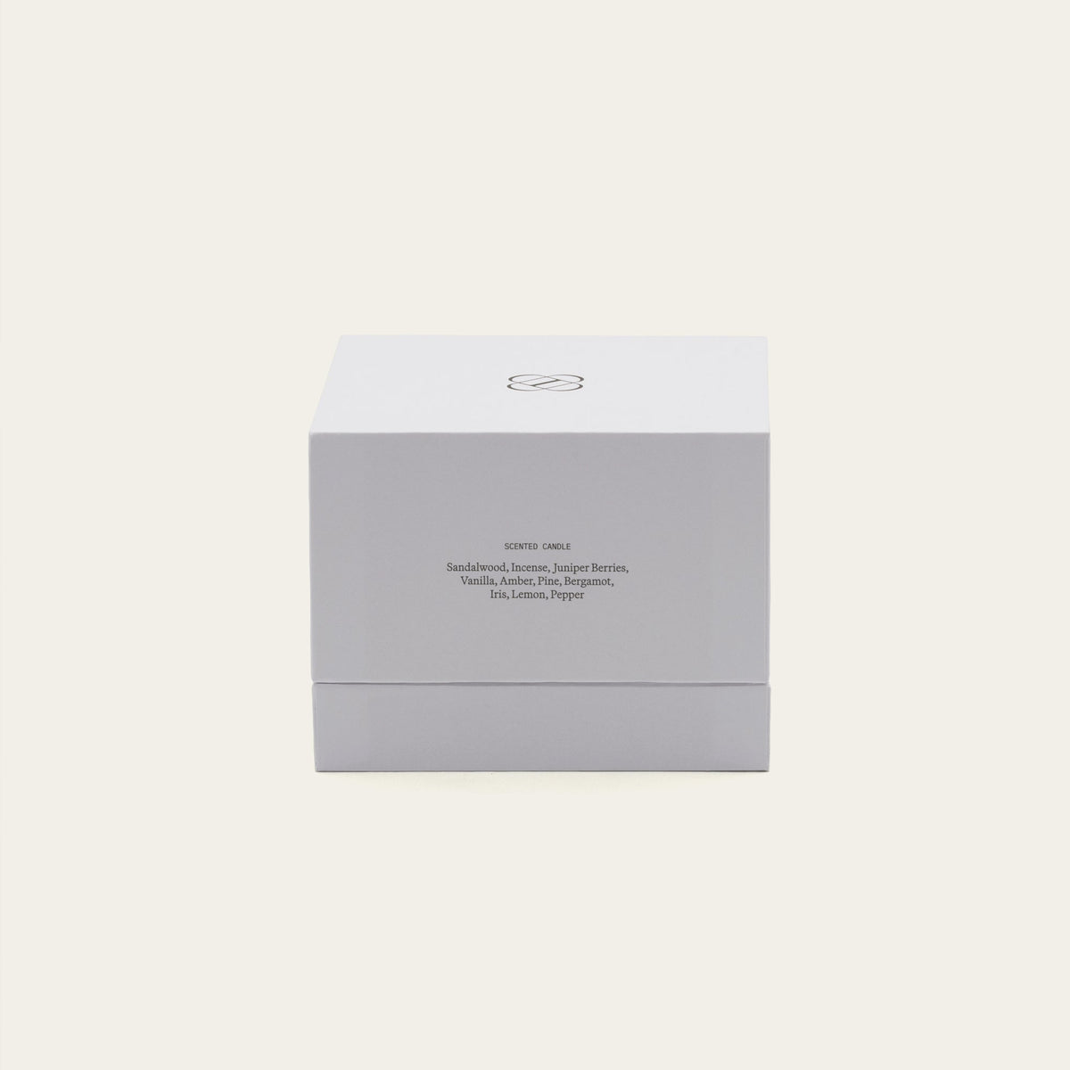 Soy wax ceramic candle box with branding and ingredient text on the back.