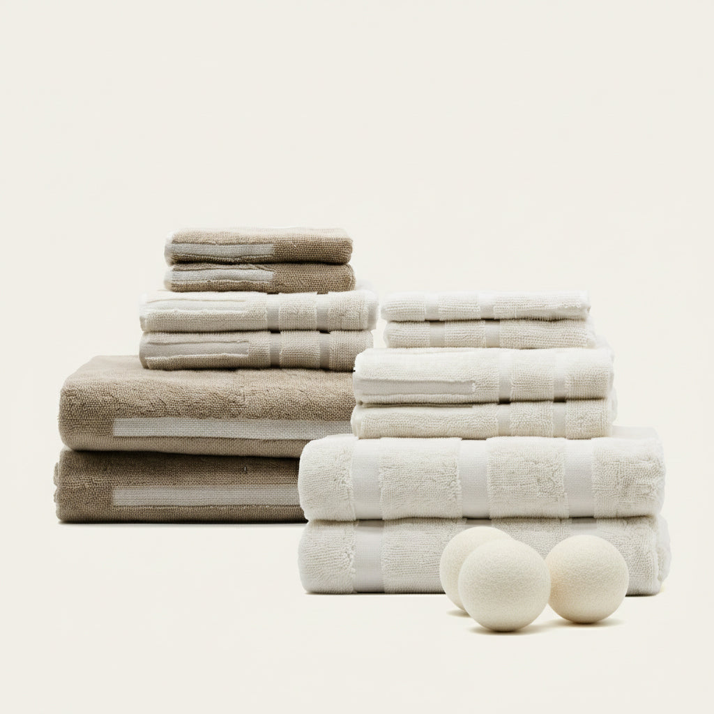Stacked cream and sand cotton towels with textured stripe pattern