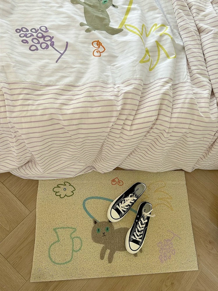 Close-up of appliqued animal designs on striped duvet cover
