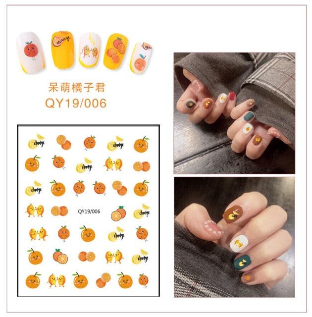 Animal and fruit nail sticker sheet with orange character icons and small crowns