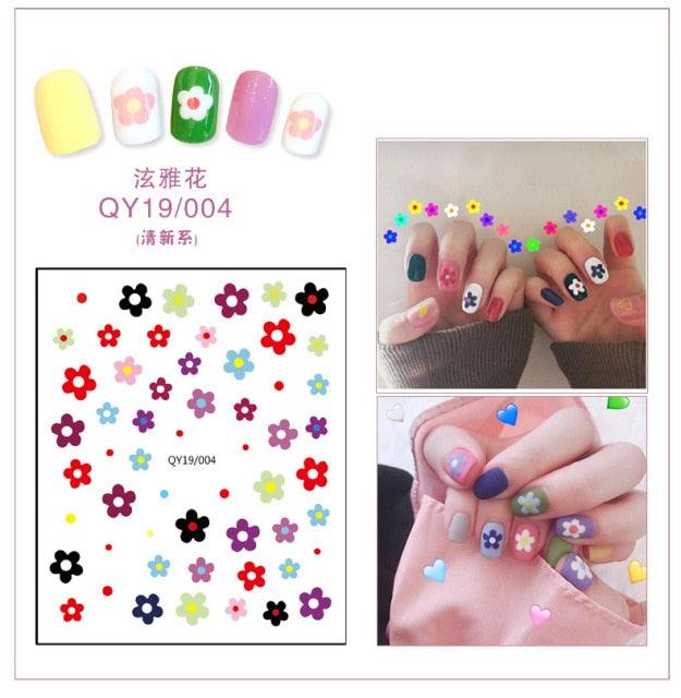 Flower and cute icon nail stickers with colorful blossoms and small stars
