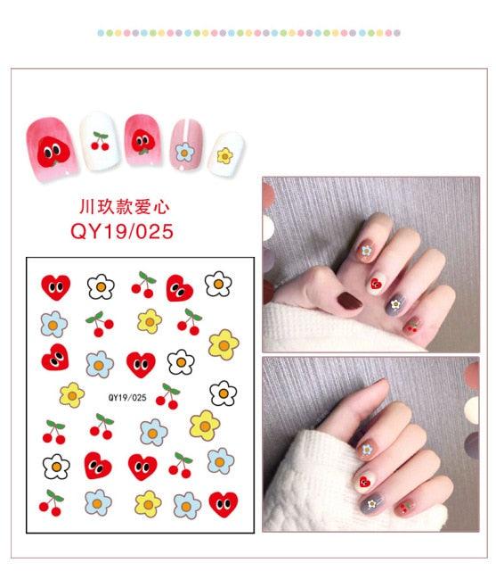 Cute face nail sticker sheet with hearts, flowers, and small red and pink icons