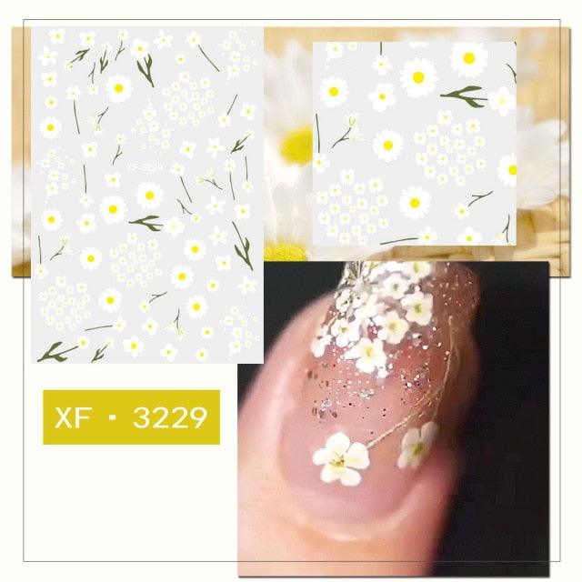 White daisy flower nail sticker set with tiny blossoms and green stem lines
