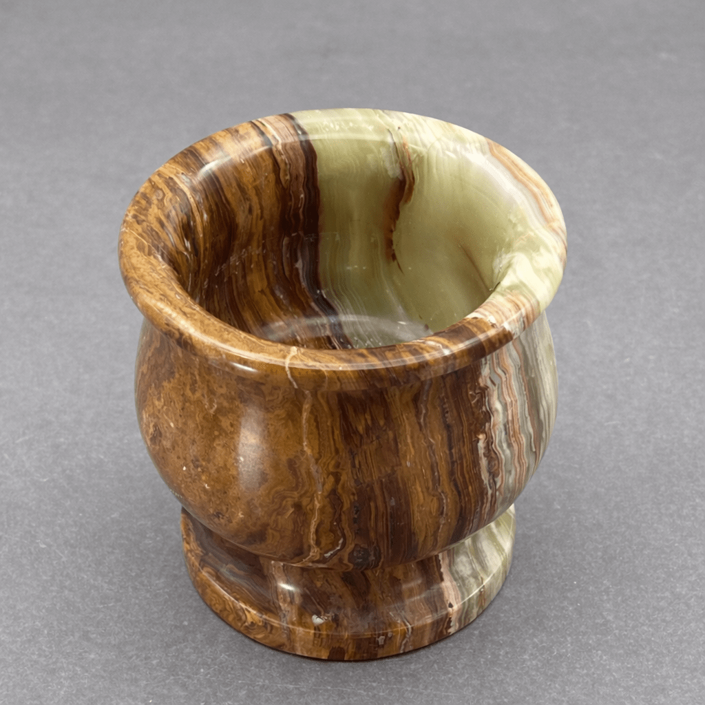Carved onyx mortar with rounded bowl, swirled brown and light green veining