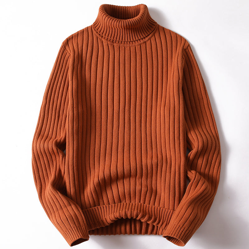 Orange ribbed turtleneck sweater with long sleeves and knit ribbed cuffs.