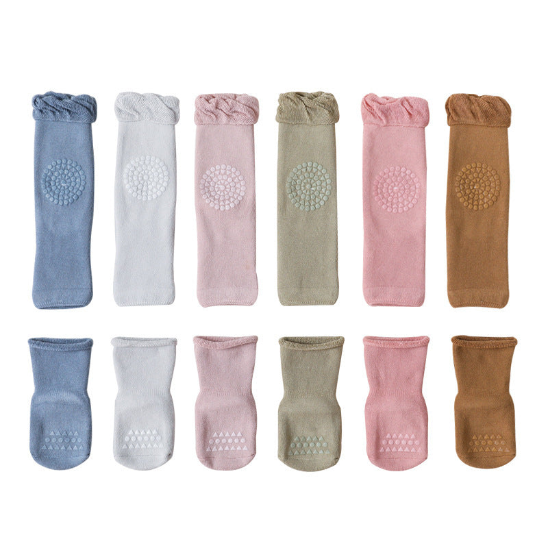 Children’s crew socks set in assorted colors, each with circular grippy tread on foot