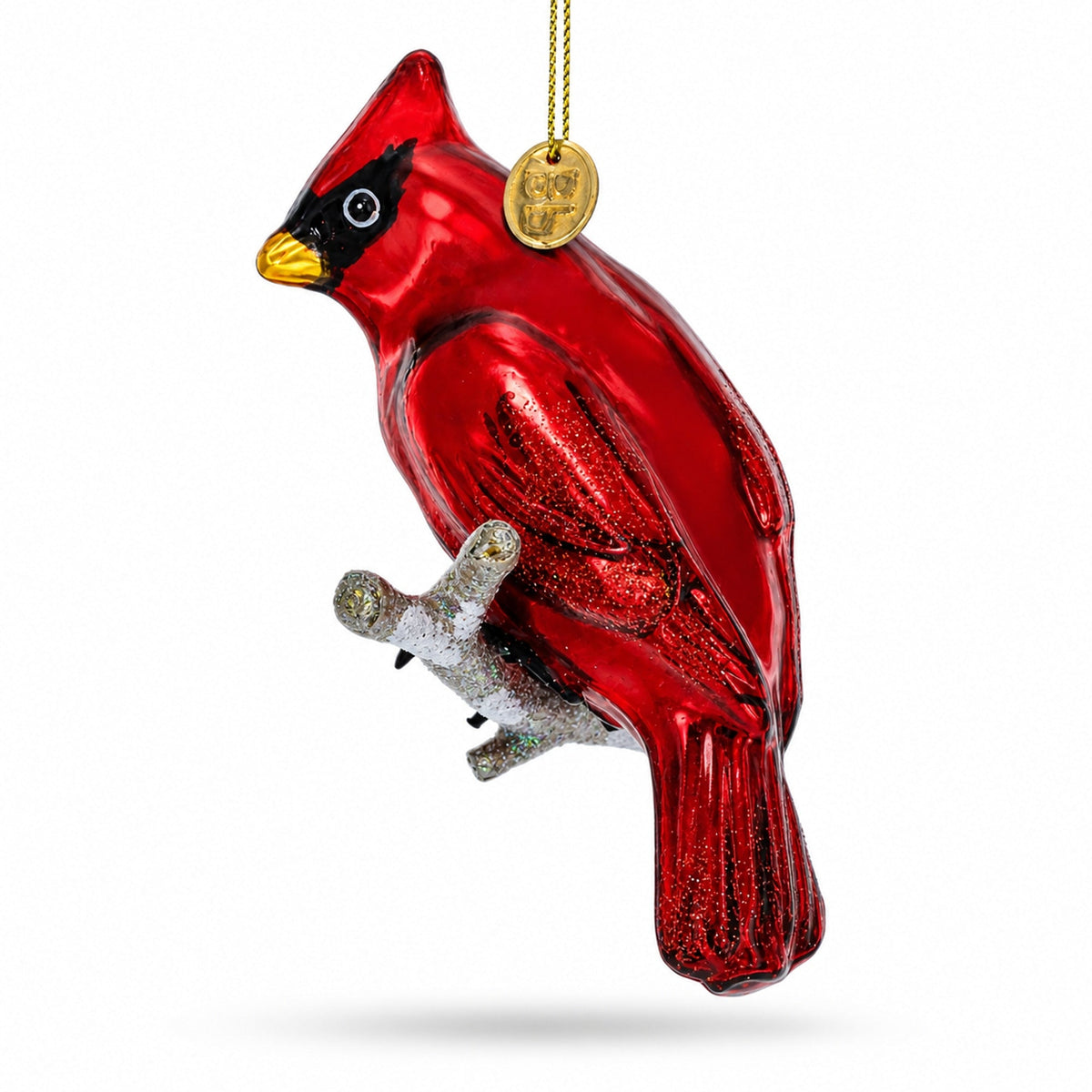 Red cardinal blown glass ornament side view, gold cord and round hanging cap.