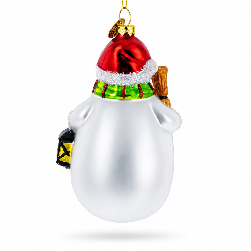 Snowman glass Christmas ornament with red hat and green scarf, broom raised at side